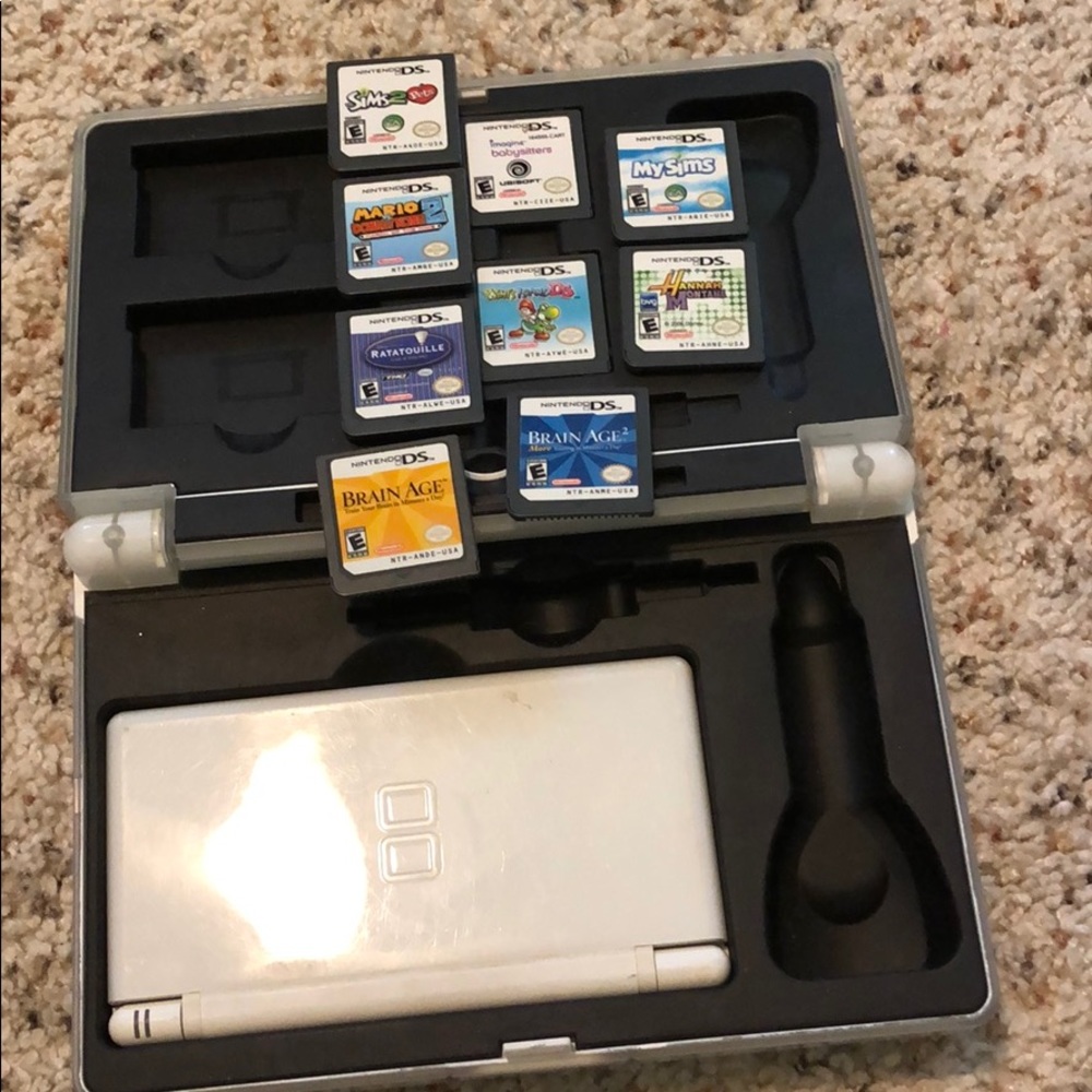 Nintendo DS with games and a case